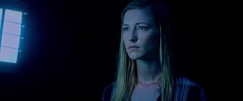 Movie still from “Insidious: The Last Key” (2018), directed by Adam Robitel – A woman with long blonde hair is staring into the dark; Close Up shot, Low angle