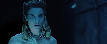 Movie still from “Insidious: The Last Key” (2018), directed by Adam Robitel – A man with long blonde hair wearing a white shirt; Close Up shot, Low angle