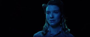 Movie still from “Insidious: The Last Key” (2018), directed by Adam Robitel – A young woman with long blonde hair wearing a blue shirt; Close Up shot, Low angle