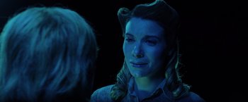 Movie still from “Insidious: The Last Key” (2018), directed by Adam Robitel – A young woman with long blonde ringlet hair; Close Up shot, Over the shoulder angle