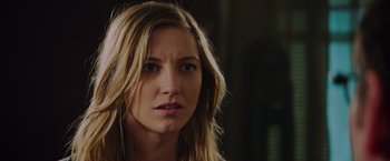 Movie still from “Insidious: The Last Key” (2018), directed by Adam Robitel – A person with long blonde hair; Close Up shot, Over the shoulder angle