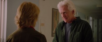 Movie still from “Insidious: The Last Key” (2018), directed by Adam Robitel – An older man and a younger woman are talking to each other; Close Up shot, Over the shoulder angle