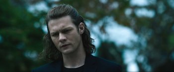 Movie still from “Insidious: The Red Door” (2023), directed by Patrick Wilson – A person with long hair; Close Up shot, Low angle