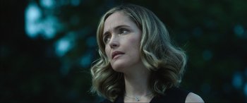 Movie still from “Insidious: The Red Door” (2023), directed by Patrick Wilson – A person with a necklace; Close Up shot, Low angle