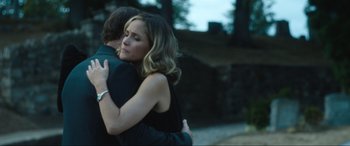 Movie still from “Insidious: The Red Door” (2023), directed by Patrick Wilson – A man and a woman hugging each other outside; Close Up shot, Over the shoulder angle