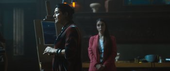 Movie still from “Insidious: The Red Door” (2023), directed by Patrick Wilson – Two women are standing in front of each other; Medium shot, Over the shoulder angle
