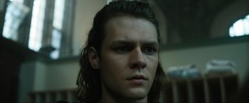 Movie still from “Insidious: The Red Door” (2023), directed by Patrick Wilson – A person with long black hair; Close Up shot, Low angle