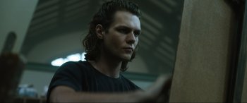 Movie still from “Insidious: The Red Door” (2023), directed by Patrick Wilson – A person with long hair; Close Up shot, Low angle