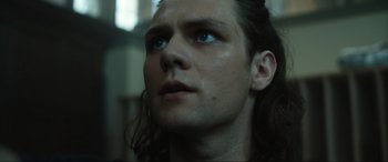 Movie still from “Insidious: The Red Door” (2023), directed by Patrick Wilson – A person with long hair; Close Up shot, Low angle