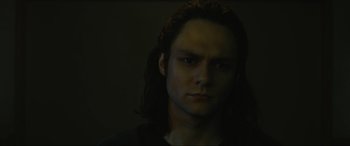 Movie still from “Insidious: The Red Door” (2023), directed by Patrick Wilson – A person with long dark hair; Close Up shot, Low angle