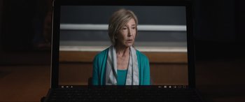 Movie still from “Insidious: The Red Door” (2023), directed by Patrick Wilson – An older woman sitting in front of a computer screen; Close Up shot, Over the shoulder angle