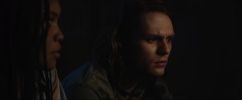 Movie still from “Insidious: The Red Door” (2023), directed by Patrick Wilson – A person with long brown hair; Close Up shot, Over the shoulder angle