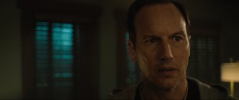 Movie still from “Insidious: The Red Door” (2023), directed by Patrick Wilson – A person looking at the camera; Close Up shot, Over the shoulder angle