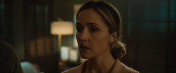 Movie still from “Insidious: The Red Door” (2023), directed by Patrick Wilson – A person wearing a pink shirt; Close Up shot, Over the shoulder angle