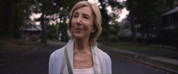 Movie still from “Insidious: The Red Door” (2023), directed by Patrick Wilson – An older woman is standing on the side of the road; Close Up shot, Low angle