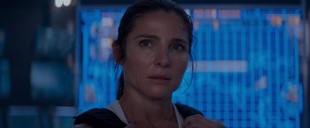 Movie still from “Interceptor” (2022), directed by Matthew Reilly – A person wearing a black and white shirt; Close Up shot, Over the shoulder angle