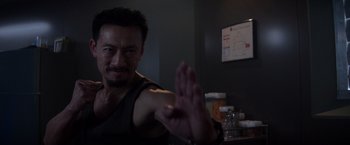 Movie still from “Interceptor” (2022), directed by Matthew Reilly – A person holding his hand up; Close Up shot, Over the shoulder angle