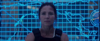 Movie still from “Interceptor” (2022), directed by Matthew Reilly – A person wearing a black shirt; Close Up shot, Low angle