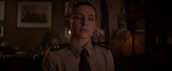 Movie still from “Interceptor” (2022), directed by Matthew Reilly – A woman in a uniform is looking at the camera; Close Up shot, Over the shoulder angle