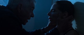 Movie still from “Interceptor” (2022), directed by Matthew Reilly – A man and a woman face to face in the dark; Close Up shot, Low angle