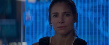 Movie still from “Interceptor” (2022), directed by Matthew Reilly – A person wearing a black shirt; Close Up shot, Over the shoulder angle