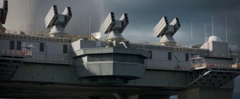 Movie still from “Interceptor” (2022), directed by Matthew Reilly – A large aircraft on the deck of an aircraft carrier; Extreme Wide shot, High angle