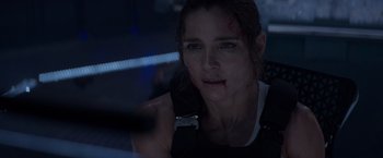 Movie still from “Interceptor” (2022), directed by Matthew Reilly – A person with blood on her face; Close Up shot, Over the shoulder angle