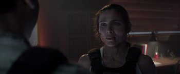 Movie still from “Interceptor” (2022), directed by Matthew Reilly – A person with blood on her face; Close Up shot, Over the shoulder angle