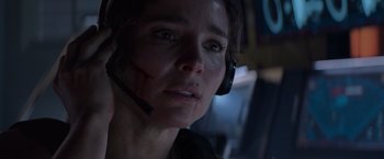 Movie still from “Interceptor” (2022), directed by Matthew Reilly – A person wearing a headset; Close Up shot, Over the shoulder angle