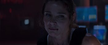 Movie still from “Interceptor” (2022), directed by Matthew Reilly – A woman's face in the dark; Close Up shot, Low angle