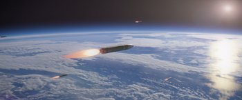 Movie still from “Interceptor” (2022), directed by Matthew Reilly – Two missiles are flying in the sky above the earth; Extreme Wide shot, Low angle