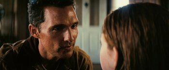 Movie still from “Interstellar” (2014), directed by Christopher Nolan – A person talking to another person; Close Up shot, Over the shoulder angle
