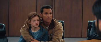 Movie still from “Interstellar” (2014), directed by Christopher Nolan – A man sitting next to a little girl in a chair; Close Up shot, Over the shoulder angle