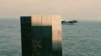 An airplane flying over a body of water