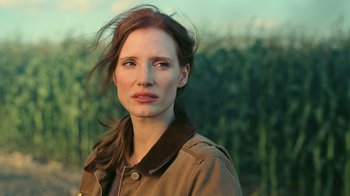 Movie still from “Interstellar” (2014), directed by Christopher Nolan – A person wearing a jacket; Close Up shot, Over the shoulder angle