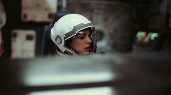 Movie still from “Interstellar” (2014), directed by Christopher Nolan – A person wearing a helmet sitting in a vehicle; Close Up shot, Low angle