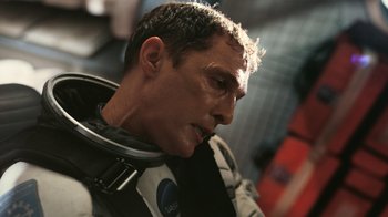 Movie still from “Interstellar” (2014), directed by Christopher Nolan – A person wearing a space suit; Close Up shot, Low angle