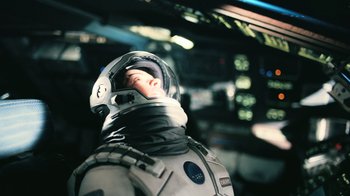 Movie still from “Interstellar” (2014), directed by Christopher Nolan – A man in a space suit and a helmet; Medium shot, Low angle