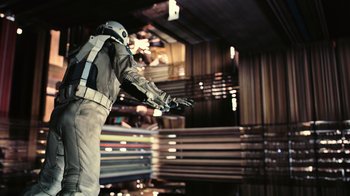 Movie still from “Interstellar” (2014), directed by Christopher Nolan – A person in a space suit is holding something in his hand; Wide shot, Overhead angle