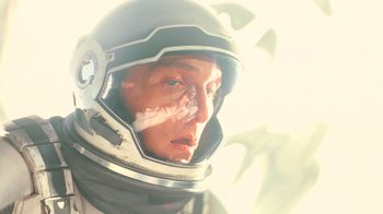 Movie still from “Interstellar” (2014), directed by Christopher Nolan – A person wearing a helmet; Close Up shot, Overhead angle