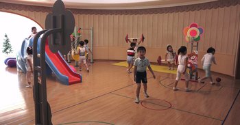 Movie still from “Into the Inferno” (2016), directed by Werner Herzog – A group of children playing a game of basketball; Wide shot, High angle