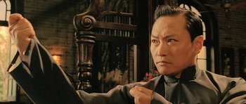 Movie still from “Ip Man” (2008), directed by Wilson Yip – An asian man is pointing to the camera; Close Up shot, Low angle