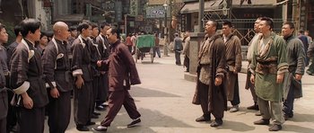 Movie still from “Ip Man” (2008), directed by Wilson Yip – A group of men walking down a street; Wide shot, Over the shoulder angle