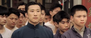 Movie still from “Ip Man” (2008), directed by Wilson Yip – A group of young men standing next to each other; Close Up shot, Low angle