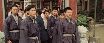 Movie still from “Ip Man” (2008), directed by Wilson Yip – A group of men standing next to each other; Medium shot, High angle
