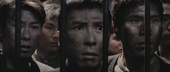 Movie still from “Ip Man” (2008), directed by Wilson Yip – A group of young men standing next to each other; Close Up shot, High angle