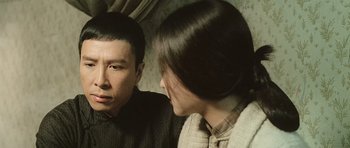 Movie still from “Ip Man” (2008), directed by Wilson Yip – A man and a woman looking at one another; Close Up shot, Over the shoulder angle