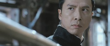 Movie still from “Ip Man” (2008), directed by Wilson Yip – A person with a drum set; Close Up shot, Low angle