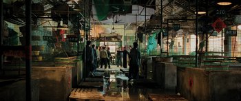 Movie still from “Ip Man 2” (2010), directed by Wilson Yip – A group of people standing around in a building; Wide shot, High angle