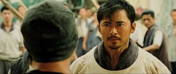 Movie still from “Ip Man 2” (2010), directed by Wilson Yip – A person with a beard; Close Up shot, Over the shoulder angle